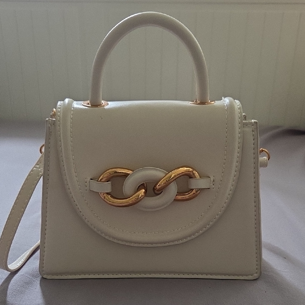 Elegant Cream Handbag with Gold Accents